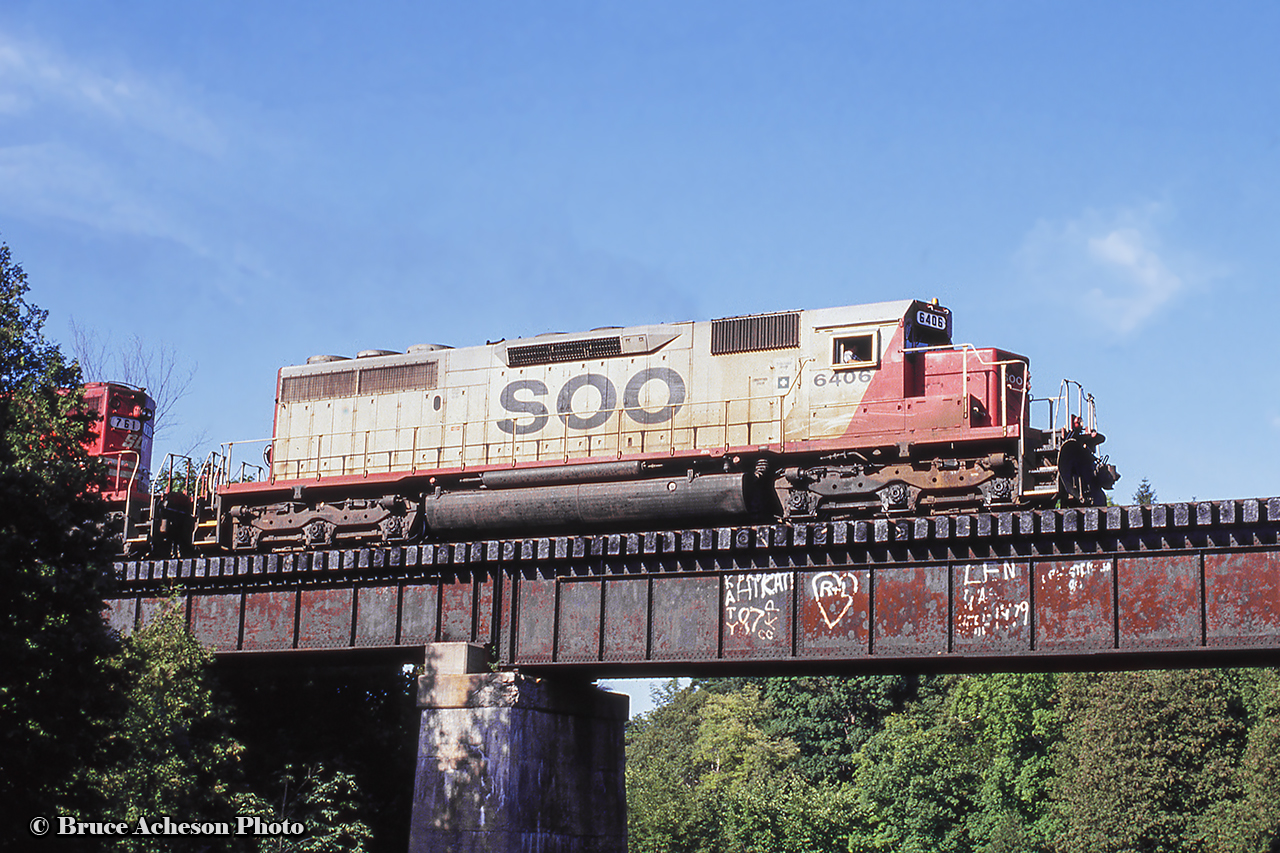 A set of SOO power leads what is likely a rock train headed for Aberdeen Yard southbound on the Hamilton sub crossing over Bronte Creek/Progreston Pond.