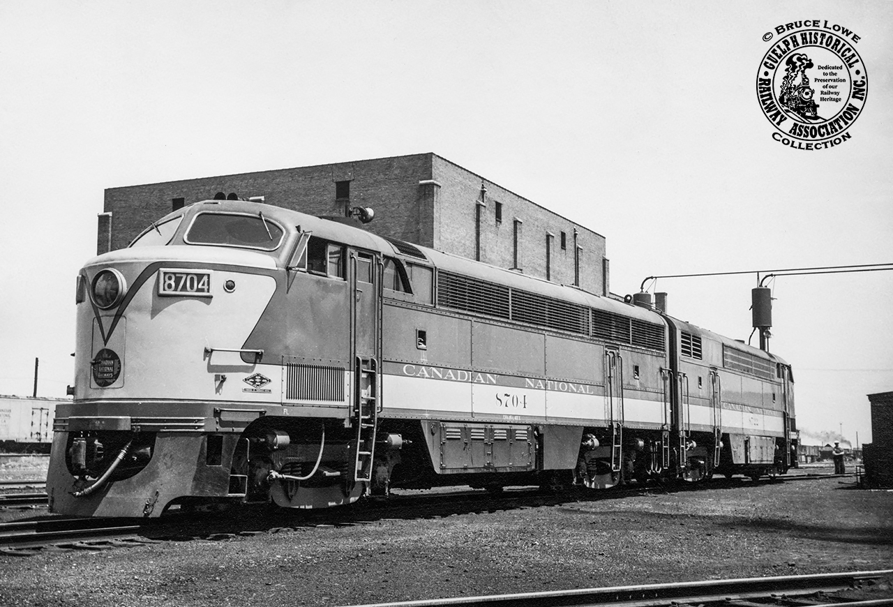On a trip out to Canadian National Railway's Mimico Yard, Bruce Lowe captured a pair of CNR's CLC CFA-16-4 units 8704 (built 1952) and 8722 (built 1953) in the servicing area near the roundhouse (behind photographer).  Only 15 at the time, this was one of Bruce's outings with noted Toronto photographer James Victor Salmon who also shot this pair on this day.  The units would be renumbered to the 9300 series in 1956 and retired during the 1960s.