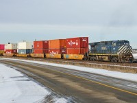 Dash 9-44CW BCOL 4649 heads an east bound intermodal through Clover Bar.