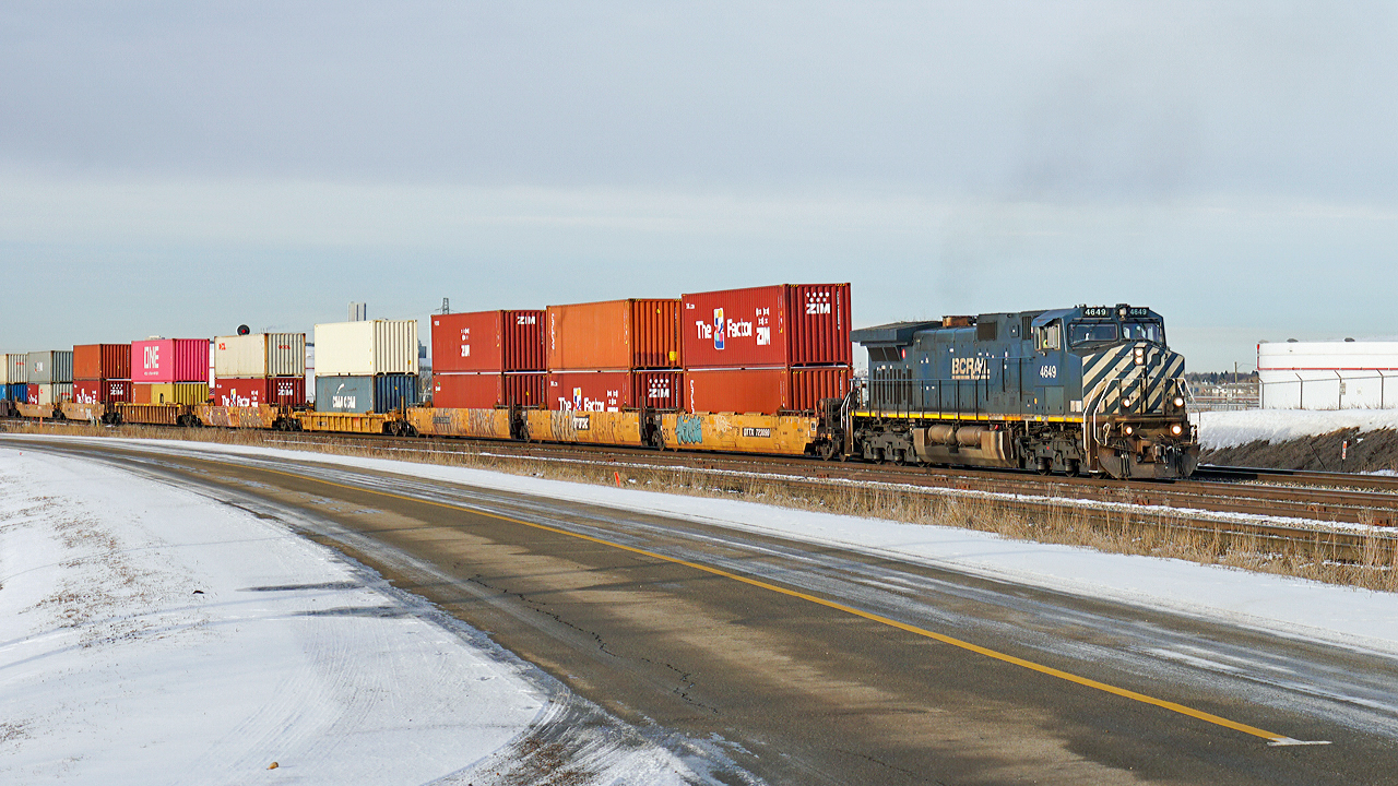 Dash 9-44CW BCOL 4649 heads an east bound intermodal through Clover Bar.