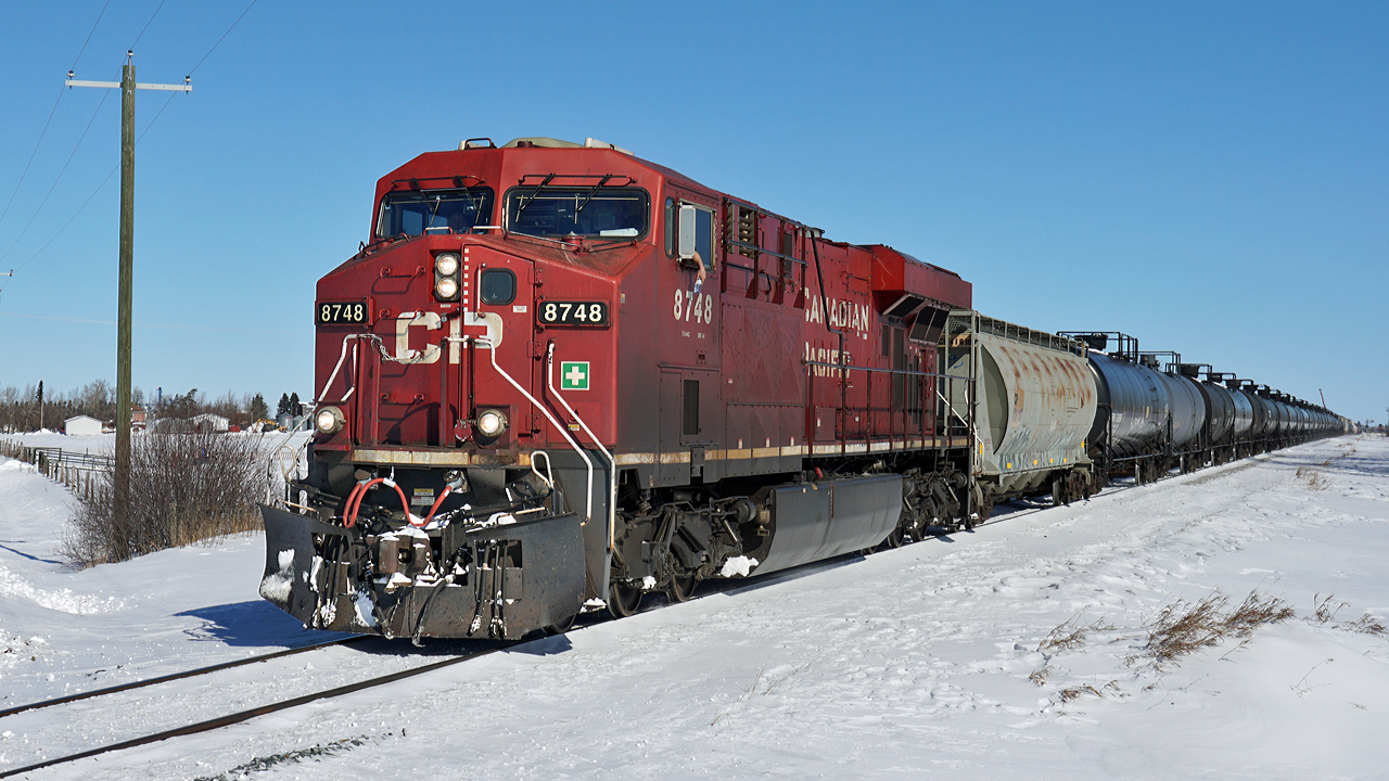 ES44Ac CP 8748 makes it's way west on a snowy Scotford Sub.