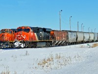 ES44DC CN 2324 sits at the head of 411 on the Scotford bypass while SD40-2(W) CN 5326 runs behind light engine.