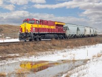 CN 3069 in Wisconsin Central heritag livery heads a frac sand hopper train west through Clover Bar.  Destination will be Sexsmith or Dalehurst.