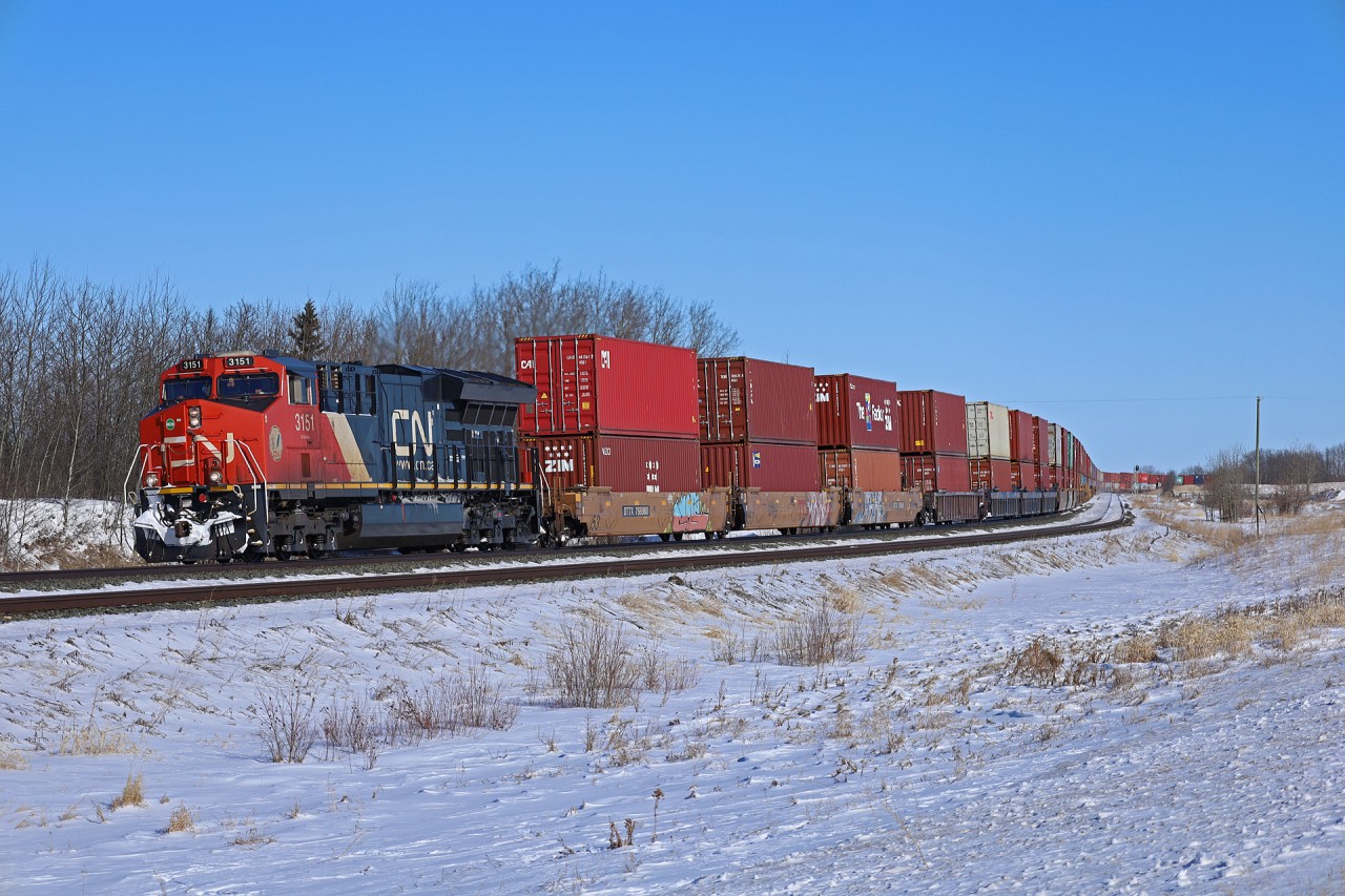 Toronto to Prince Rupert Q 18331 06 snakes through the S Curve at Lindbrook with CN 3151 and 96 platforms
