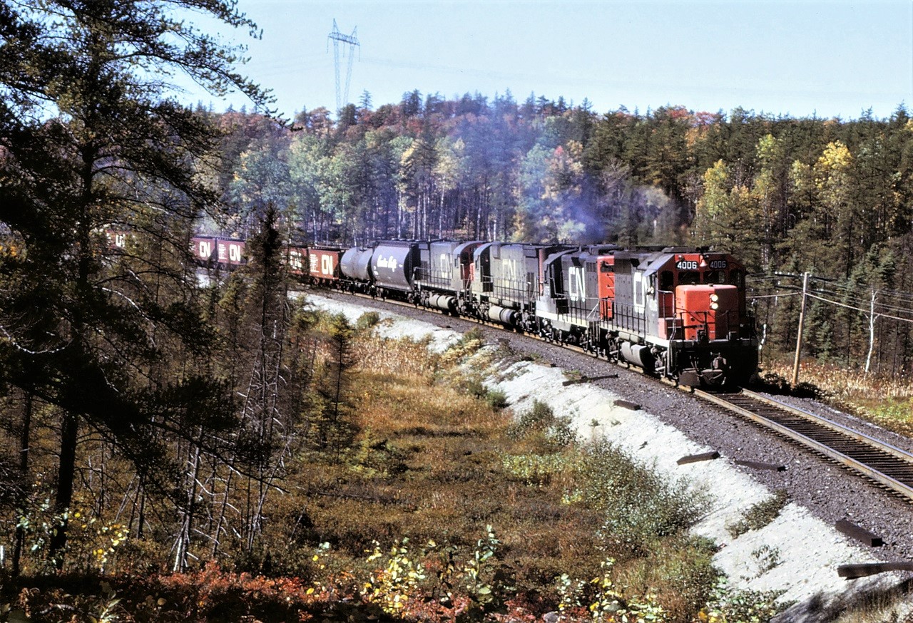 CN train 308 heads east out of Capreol on the now abandoned Alderdale Sub.  Power for the train is GP40 4006, GP9 4575, and M636s 2337 and 2330.  The headend cars are headed for a set off at Transfer Yard (North Bay). Location is approximate.
