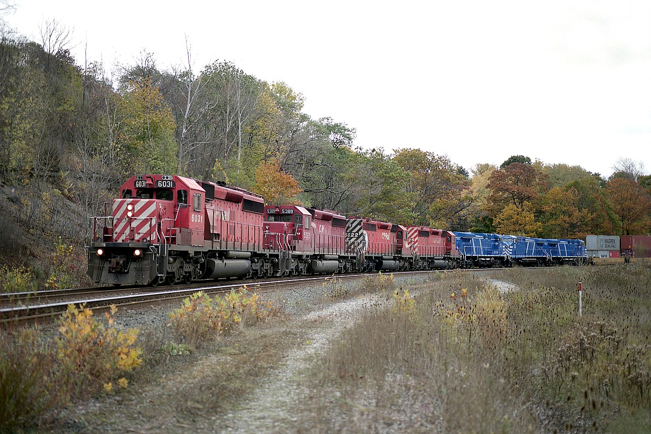 Lot of power on this afternoon's #419 as it rounds the bend just below the Hamilton cemetery out on approach to the High Level bridge.  CP 6031, 5389, 5822, 5725 and brand new CEFX 1036, 1035 and 1034. Note the second unit was a former Ontario Hydro unit. It was dealt off to Progressive Rail in 2005 and made its' way eventually to Brazil.