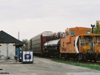 More than a decade after cabooses were removed from active mainline service, here CP 422992 is viewed bringing up the rear of a westbound as it passes the Galt station on the Galt Subdivision.  

