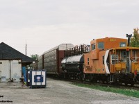 More than a decade after cabooses were removed from active mainline service, here CP 422992 is viewed bringing up the rear of a westbound as it passes the Galt station on the Galt Subdivision.  

