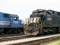 A decidedly "un-Canadian" scene.  Yet this is in Fort Erie down the yard toward CN Duff; as departing trio of Conrail GP38s, 7936, 7939 and 7937 heading toward the International Bridge happen by the NS transfer which has just arrived behind NS 8558 and 8619.  The C39-8 I always considered looked like some sort of ugly beast, and I have heard the crews didn't think a whole lot of them either. Total of 161 built (years 1984-1987), on NS at least they are all retired.