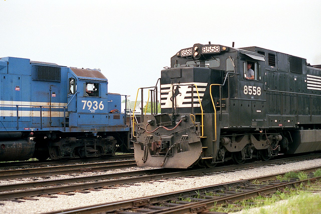 A decidedly "un-Canadian" scene.  Yet this is in Fort Erie down the yard toward CN Duff; as departing trio of Conrail GP38s, 7936, 7939 and 7937 heading toward the International Bridge happen by the NS transfer which has just arrived behind NS 8558 and 8619.  The C39-8 I always considered looked like some sort of ugly beast, and I have heard the crews didn't think a whole lot of them either. Total of 161 built (years 1984-1987), on NS at least they are all retired.