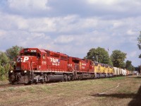 I didn’t make a lot of trips to London over the years. I kind of wish I did, especially while GMD was still around and in the locomotive business. It is unfortunate most new locomotive deliveries headed west out of London and not east so I didn’t catch too many on this side other then the Canadian roads and the occasional CSX unit. This day passing by CP’s yard we found a pair of brand new Union Pacific  SD70M’s numbered 5114 & 5113. It wasn’t long before train 261 arrived and lifted the units so we headed a bit west and waited. Luckily the clouds finally cleared as the train arrived. 