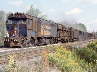 Rail grinding has always been an interesting part of railroading, no matter what time of day it is. Typically most grinding seems to happen at night but certainly not always. P&J, latter HTT had some interesting train sets roaming the rails prior to the more common sets we see today. RMS set #5  was powered by F40PH-2C RMS- 511, one of only 4 of these units built. It unfortunately was scrapped years ago. The trailing two passenger cars are ex GO Transit single level cars. Here the train is seen grinding eastbound at Campbellville with sparks flying from under the cars. The men on the end platform are on the constant look out for small fires caused by sparks from the train. 
