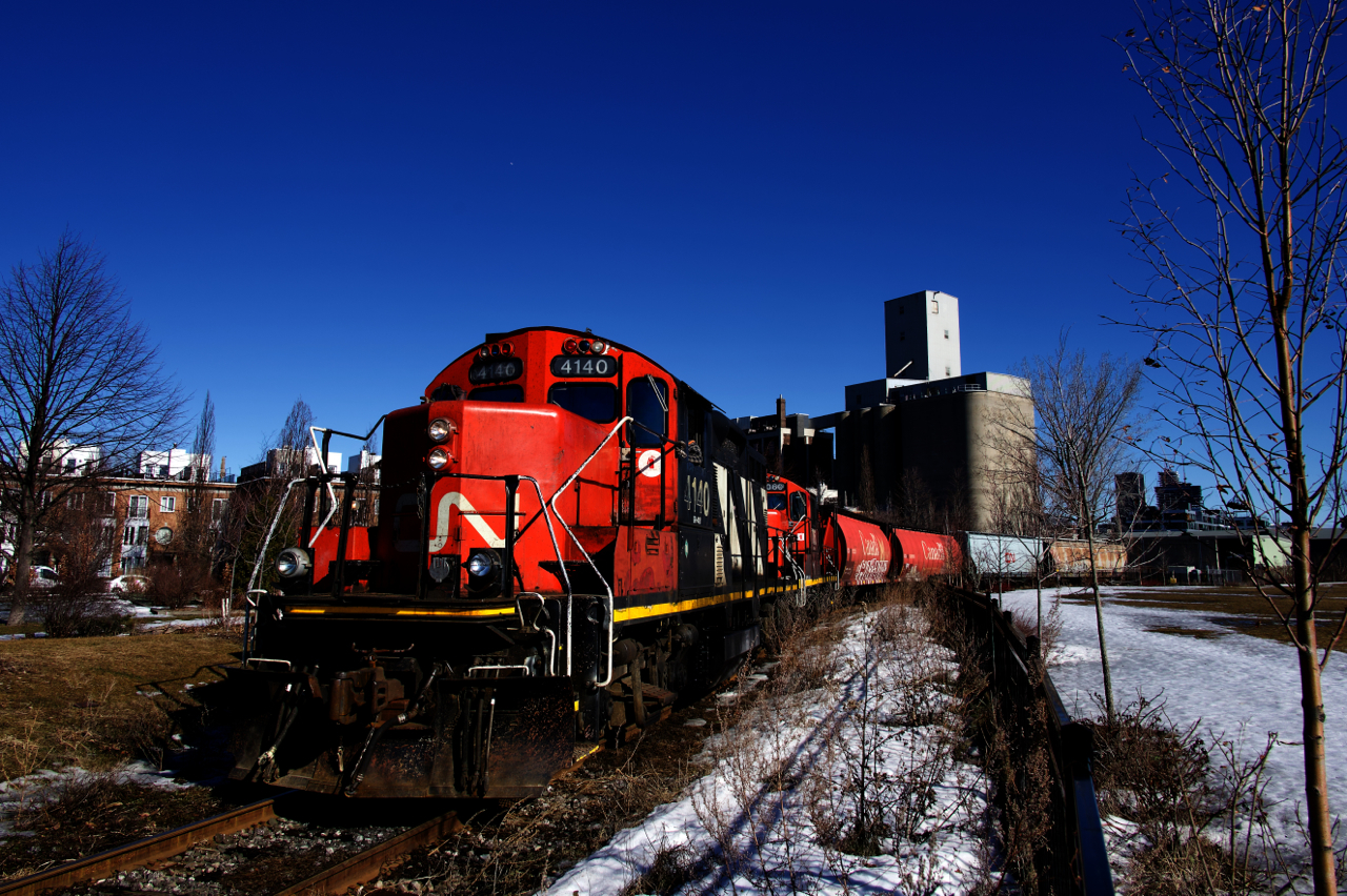 Four grain cars are being set off at Ardent Mills, the last client remaining on CN's East Side Canal Bank Spur.