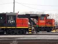 Both Stuart Street yard jobs have parked by the office for the crews to have their morning coffee break. CN 7524, CN 4726 and CN 9427 had been switching the east end of the yard while CN 7241 and CN 7080 were switching the west end.  After break, the GP9RMs would return to switching the yard while the triple-set would put a train together and depart the yard to go switch the north end industrial area.  Kudos to the paint crew that neatly repainted the cab numbers on "7241" in the original font! 