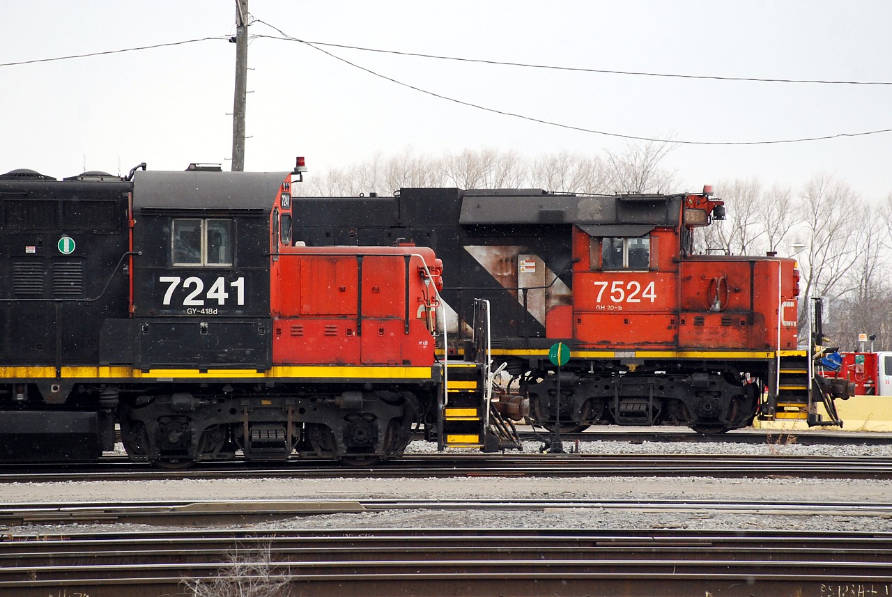 Both Stuart Street yard jobs have parked by the office for the crews to have their morning coffee break. CN 7524, CN 4726 and CN 9427 had been switching the east end of the yard while CN 7241 and CN 7080 were switching the west end.  After break, the GP9RMs would return to switching the yard while the triple-set would put a train together and depart the yard to go switch the north end industrial area.  Kudos to the paint crew that neatly repainted the cab numbers on "7241" in the original font!