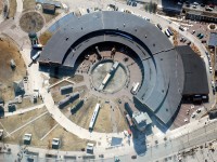 A crew of volunteers at the Toronto Railway Museum use the museum's CLC/Whitcomb 50T to position a flat car on the turntable.  Viewed from the CN Tower SkyPod, 447 metres above.