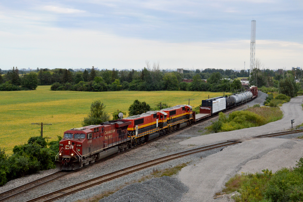 CP ES44AC #8765 leads PRLX SD70MACs #3927 and #3964 up the Canadian Pacific Mactier Subdivision on CP 421 as it passes by the Vaughan Intermodal Terminal.