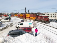 This train was full of surprises. First, we were anticipating a roadswitcher to be heading east, not a through freight. Then, a CN unit rolled by as mid-DPU (the first of two trains like that on this day) and finally, the tail end had two units together as rear helpers. Not a bad improvement over a roadswitcher.