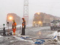 A side of railroading that most of us don't ever have to witness. A moderate ice storm swept through Sudbury overnight, followed by warm temperatures and a thick fog for good measure. CP crews are working to pump water out from switches in the yard, an important task before we returned to seasonal temperatures the following day and everything froze solid again. Based on the three-foot-deep snow I trudged through the day before, there's going to be a lot more pumping to come this year. Here, HCRY 913 gets ready to head west next to the waiting U52 (I thought I heard 52, but U55 is the job mostly working the yard so I'm doubting myself).<br><br>Also of note, the left worker (never got his name) told me a story of a woman who had some sort of episode and drove a brand-new pickup <i>through</i> the yard, crashing into a couple of tank cars in two different locations before coming to a stop across and far up the tracks by the station. If you know any workers in Sudbury, get them to tell the story and show you photos some time. Hope she's doing alright.