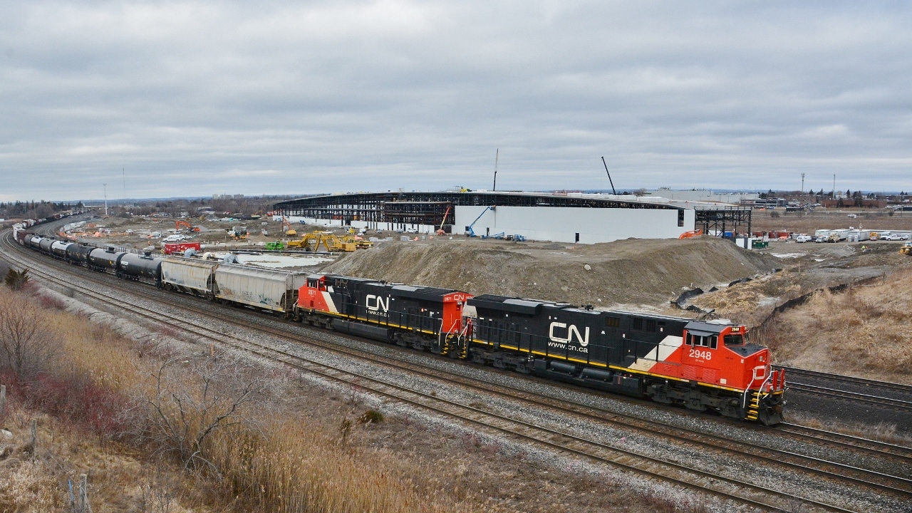 A pair of GEVO-12's roll east at the site of the GO Transit Whitby Rail Maintenance Facility WRMF.


   One year old ES44AC  CN #2948 (GE February 2015) and September 2014 GE built CN #2871 with a mixed consist.


   From the now removed Hopkins Street overpass (removed late 2016), February 29, 2016 digital by S.Danko.
