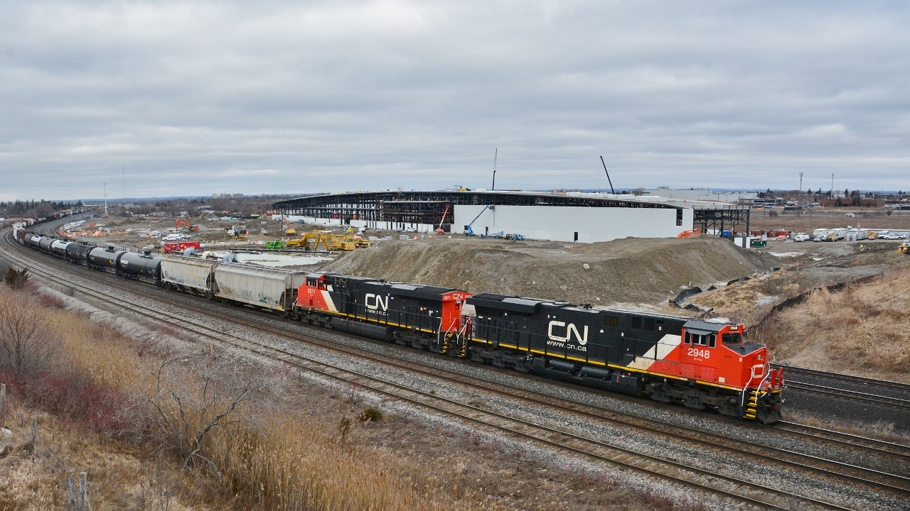 A pair of GEVO-12's roll east at the site of the GO Transit Whitby Rail Maintenance Facility WRMF.


   One year old ES44AC  CN #2948 (GE February 2015) and September 2014 GE built CN #2871 with a mixed consist.


   From the now removed Hopkins Street overpass (removed late 2016), February 29, 2016 digital by S.Danko.