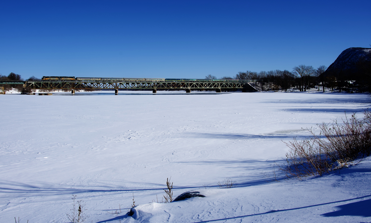 VIA 15 from Halifax is crossing the Richelieu River on a cold winter morning. VIA 15 is currently running twice a week and arrives in Montreal on Monday and Thursday mornings. Since VIA 14 and 15 were reinstated in August 2021 (after not running since March 2020), this train has been running with back to back F40s and a mixed HEP/Renaissance set of cars, and no Park Car. This is because the train can no longer be turned on a balloon track in Halifax, with PSA Halifax (the owner of a container terminal) having taken back access to that track in November 2020. The power has to be back to back as it runs around the train and the first car on eastbound VIA 14 becomes the last car on westbound VIA 15.