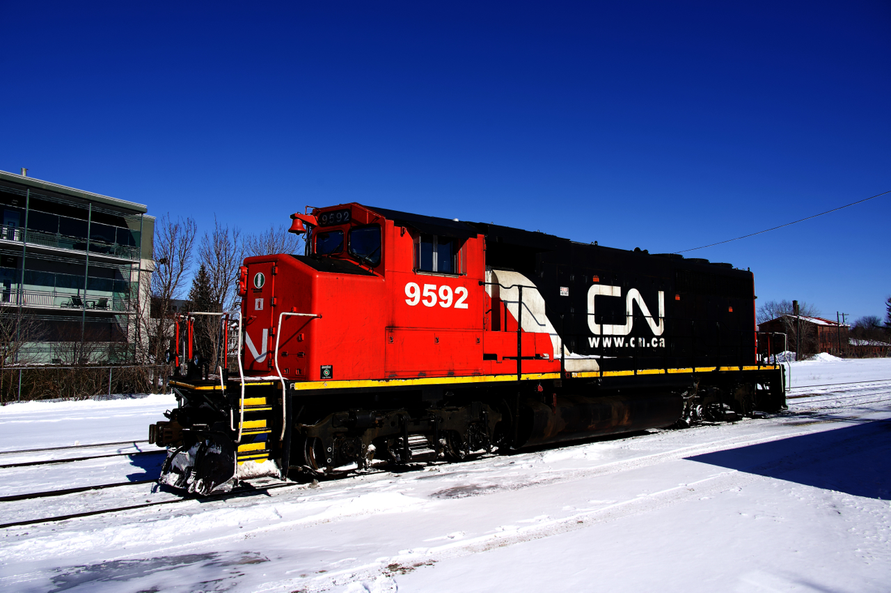 After crossing over from the north track to the south track at Montbec, CN 9592 is heading to pick up some cars for the St-Jude Spur in track E109.
