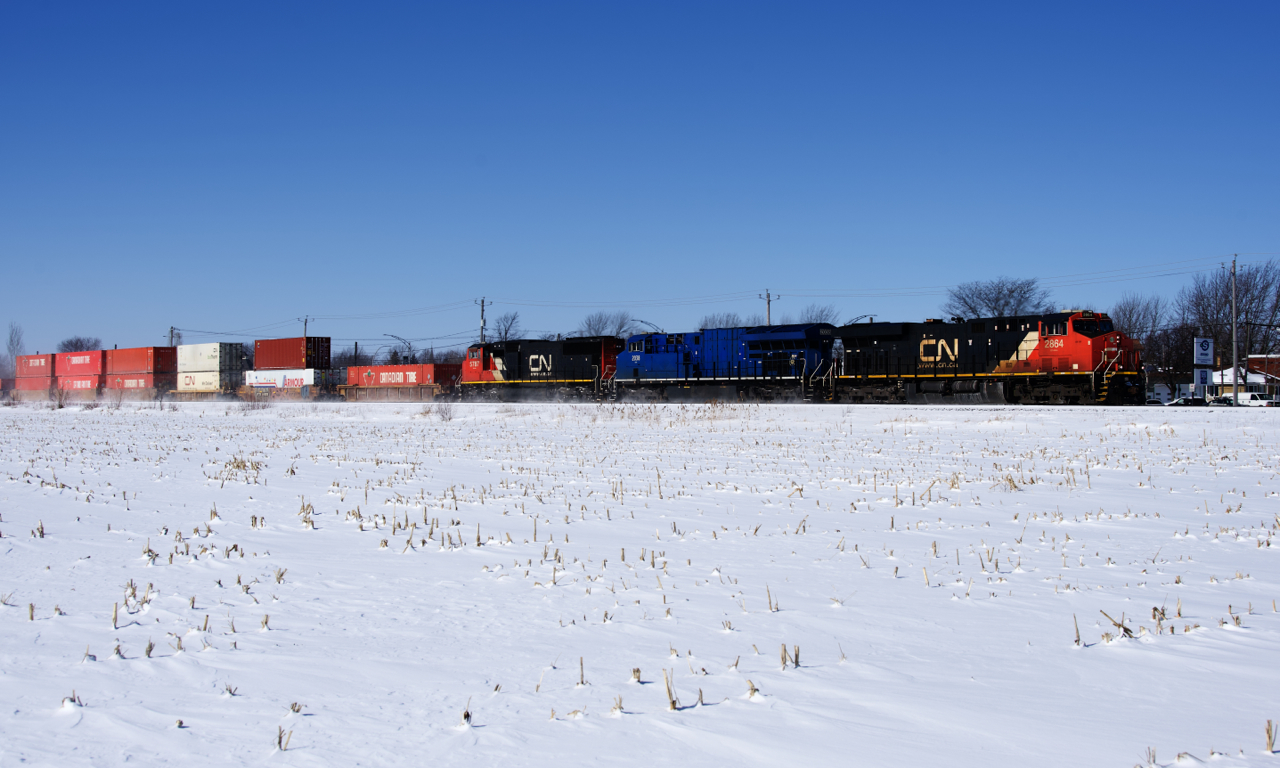 CN 120 will soon leave the St-Hyacinthe Sub for the Drummondville Sub as it heads east with a shorter than usual train and CN 2864, GECX 2038 & CN 5787 for power.