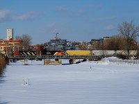 The Pointe St-Charles Switcher has CN 4140 & CN 4720 for power as it crosses the Lachine Canal. It is bringing cars from the Butler Spur to the Freight Track at Turcot Ouest.