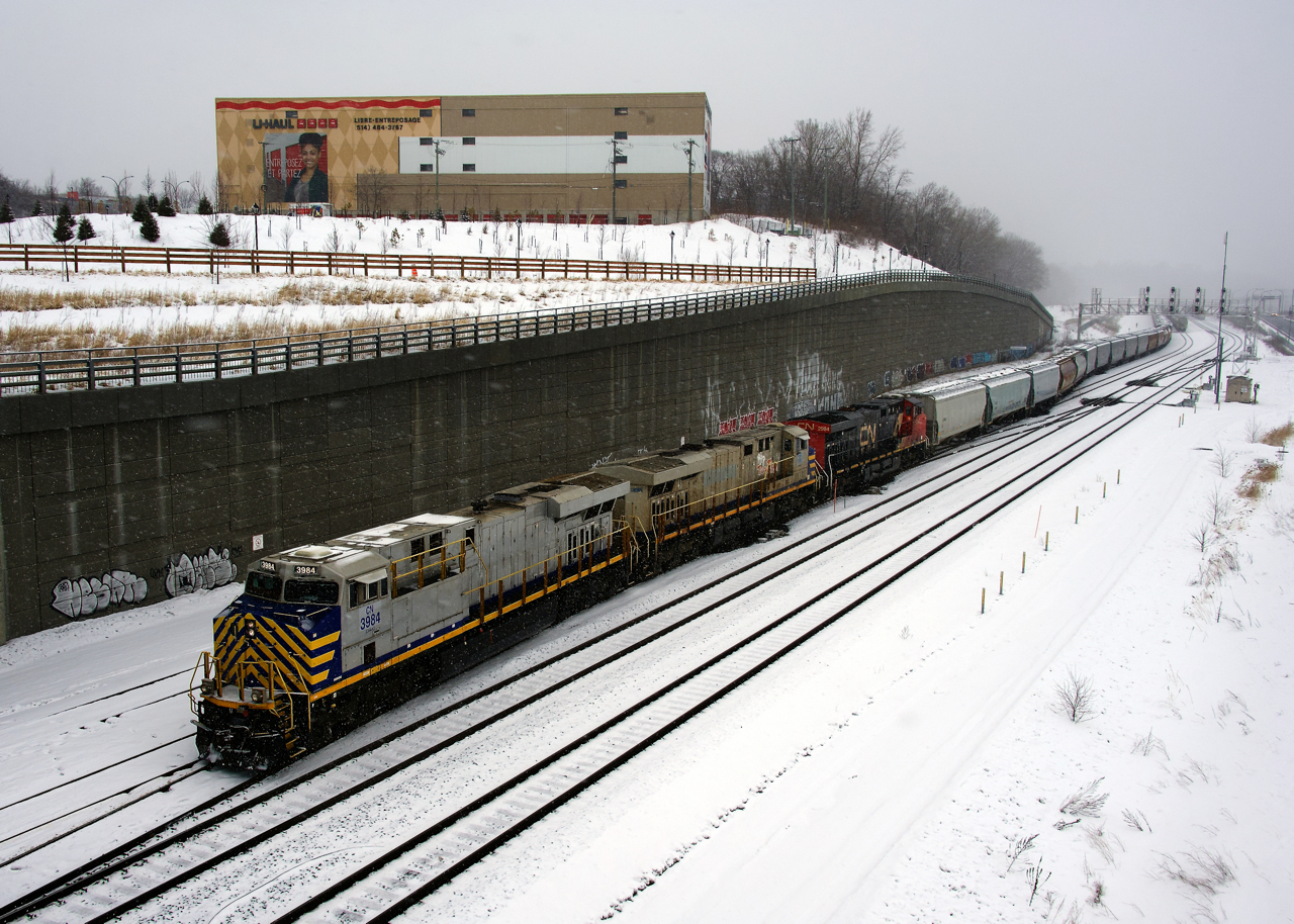 The snow is flying as CN 522 shoves cars into Track 29 at Turcot Ouest. Two ex-CREX units lead a regular CN unit (CN 3984, CN 3941 & CN 2984). CN 3984 had been on lease to CN as CREX 1514 a few years back.