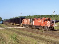 The mornings were once a great time to be at Guelph junction. Often a trio of freights almost block on block would arrive. CP 142 the “sprint train” was one of the hottest trains operating over the line. Daily automotive frames from St. Thomas to the large GM assembly plant in Oshawa would polish the rails. Unfortunately a number of years ago the plant in Oshawa shut down ending any need for the train. The plant has since opened to a certain extent but the trains have yet to return. The unique MLW control cab sets were a nice catch on train 141/142 until they were retired. Here train 142 has just entered Guelph junction in the mid morning hours. 