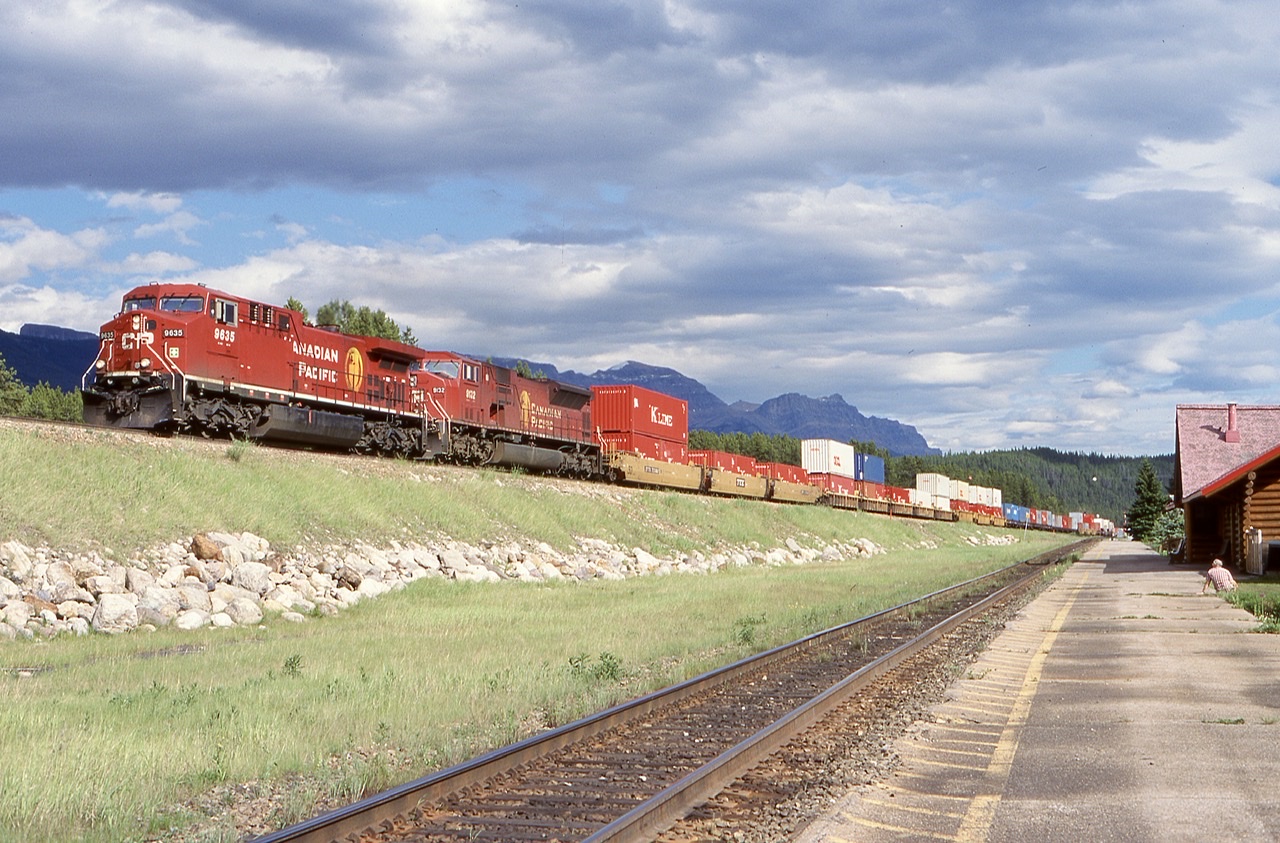 Taking the high road. An AC4400 / SD90 digs into the uphill grade as it enters directional running at Lake Louis.