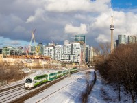 GO Transit's pilot project runs empty from Willowbrook yard to Union before picking up passengers and heading west to London for the evening. The gloomy weather all day had finally cleared but was still hovering over the city, creating an interesting backdrop. Even I can admit the new "CEM" cab cars look ok in perfect light. 