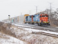 GTW's 5849 & 6420 fly through mile 2.5 of the Halton Sub as with a cut of auto racks they pulled from Brampton Intermodal. 