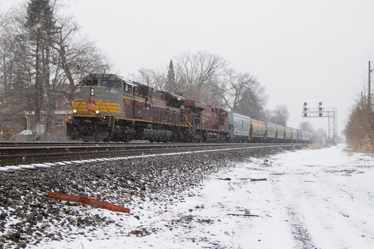 CP 246 with 7018W has it's lights out of they yard as it departs Lambton with 1,800ft of loaded grain hoppers.