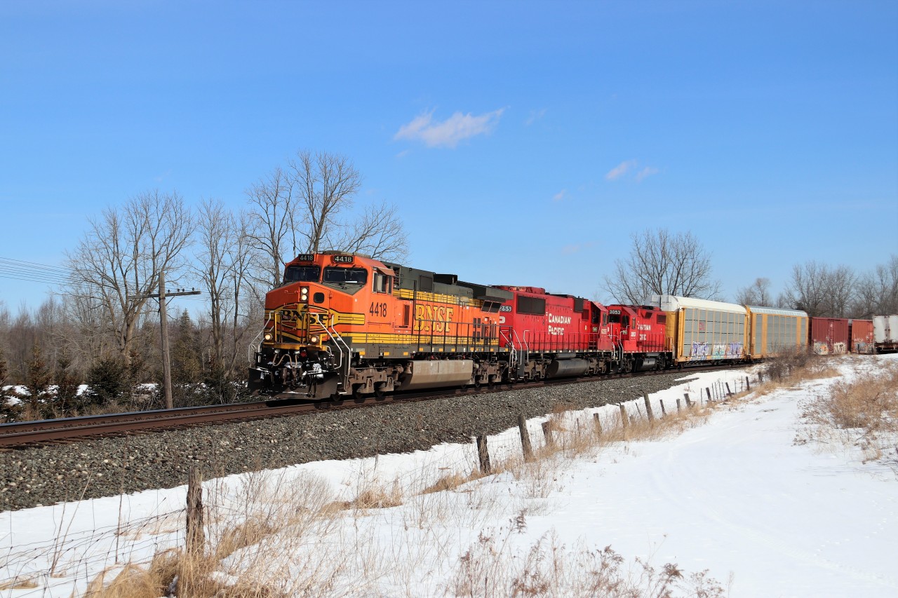 It's a beautiful sunny day and Canadian Pacific gave us a very nice train to shoot.  BNSF 4418 with CP 6255, CP 3053 and a mid dpu CP 9683 power a very late CP 141 up to the Victoria Road crossing as they head west up the Galt sub.