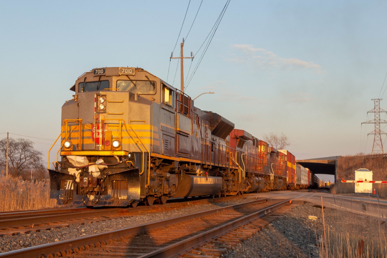 CP 235 backs up into into the Jefferson siding at Walkerville JCT with 7010 in golden hour... After getting told that 235 went into emergency near Tilbury, I had doubts that I was going to be able to see this train during the daylight hours. I was very close to leaving after hearing the news but decided to stay and wait it out. I got lucky with the lighting as it was mostly cloudy for most of the day in Windsor but it decided to clear up as 235 was making its way here.
