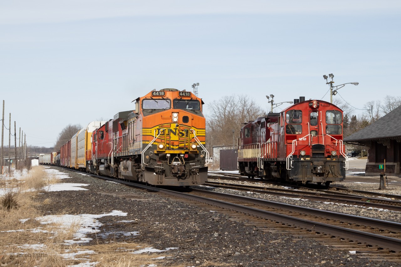 CP 141-04 flies through Woodstock, Ontario passing the OSR power sitting by the old Woodstock Station while their crew has lunch.