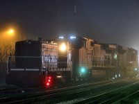 A43431 16 switching Brantford on a foggy evening with CN 8963, CN 2621, and JLCX 6089. 6089 was delivered to Stelco as SW900 #89 in June of 1964