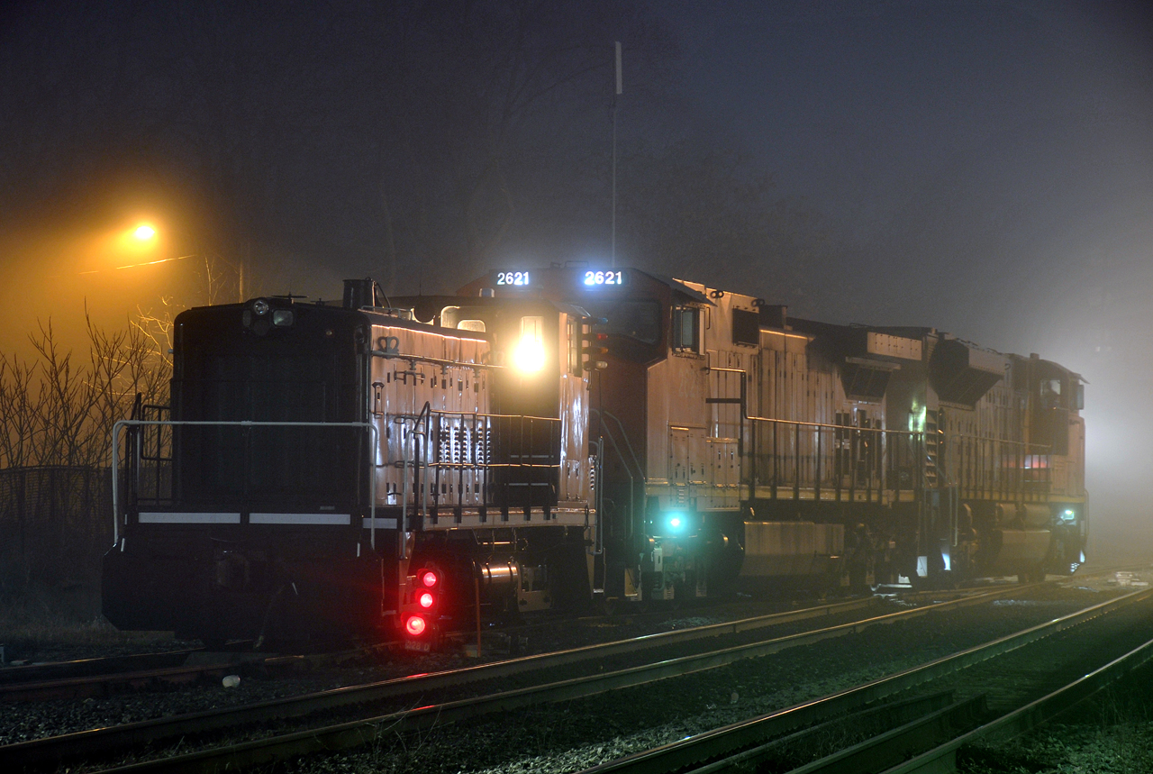 A43431 16 switching Brantford on a foggy evening with CN 8963, CN 2621, and JLCX 6089. 6089 was delivered to Stelco as SW900 #89 in June of 1964