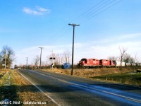 A film scan that I shot in March 2004 - I chased the Welland yard job on the CASO and Dunnville spur for a bit, while my photography skills in those days weren't all that great and I had absolutely no idea what I was doing, I did get a few keepers here and there. This is one of them showing the train as they blast along the CASO at a blistering 10 mph..... it was really really really slow. And boring. So I gave up. Probably should have gone all the way but I took everything for granted back then :)