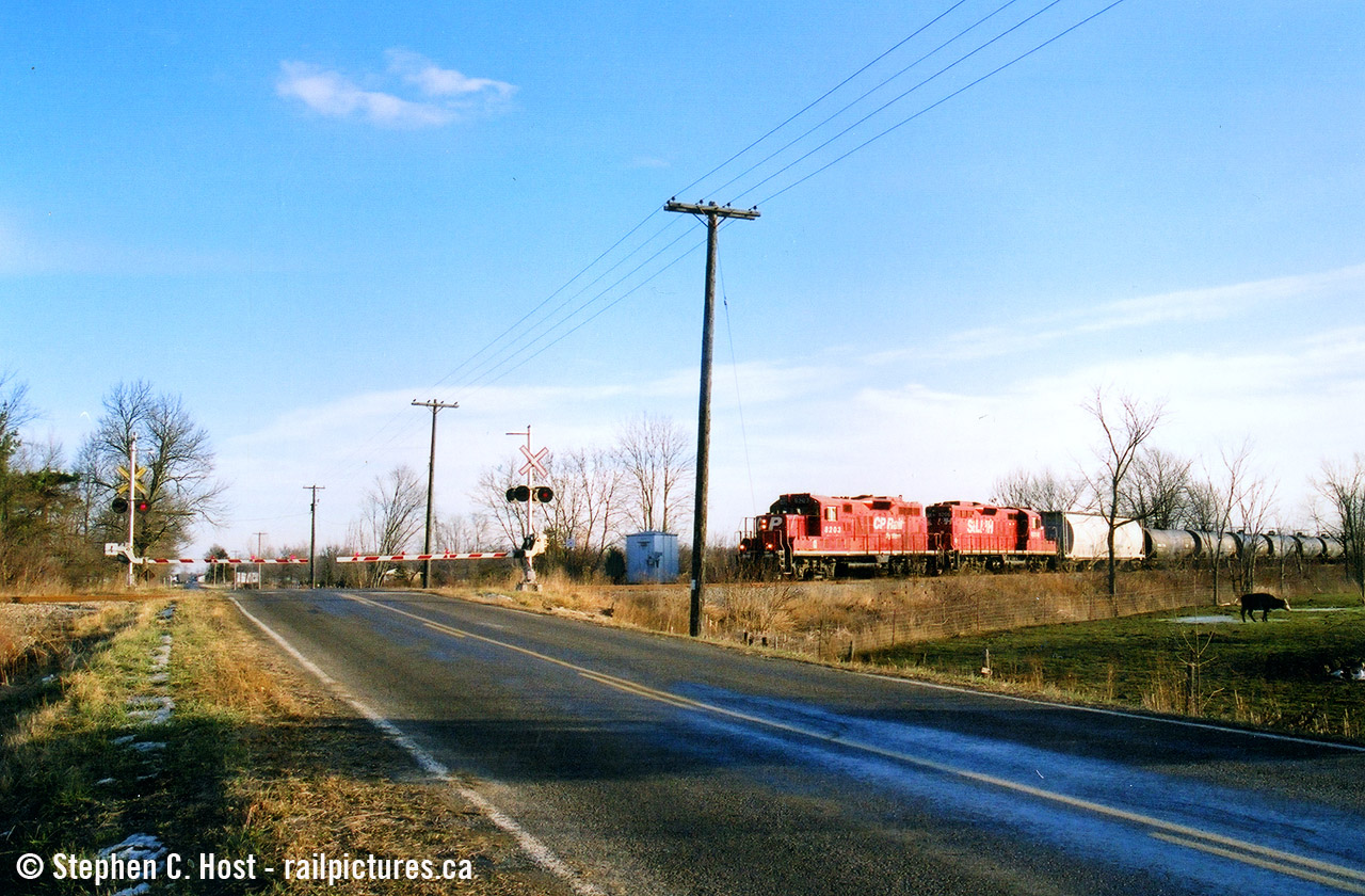 A film scan that I shot in March 2004 - I chased the Welland yard job on the CASO and Dunnville spur for a bit, while my photography skills in those days weren't all that great and I had absolutely no idea what I was doing, I did get a few keepers here and there. This is one of them showing the train as they blast along the CASO at a blistering 10 mph..... it was really really really slow. And boring. So I gave up. Probably should have gone all the way but I took everything for granted back then :)