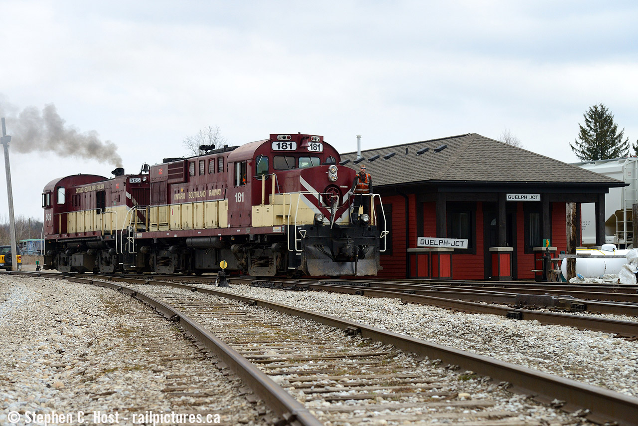 Hostler/Mechanic Apprentice Tom Nichol rides on RS-23 505 as the mechanical crew shuffle power around preparing for the 1400 job which would be on duty soon. I brought a little something with me from the collection of the Guelph Historical Railway Association to pose it on the station beside the recently placed OSR signs. Located near the site of the old Guelph Junction Station, this building was built in 2016-2017 by OSR to provide crew and office quarters. It's still there, still owned by OSR and leased to GEXR (but on GJR property, it's complicated!) but the Guelph Junction signs were removed by OSR upon their departure. G&W safety signs now adorn this building typical of their usual corporate branding and safety culture awareness strategy.