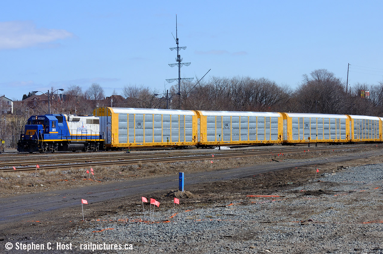 The Southern Ontario Railway (RLHH Reporting marks) 0800 job is emerging out of the hole after fetching a cut of brand new CSX fully built autoracks from National Steel car. In the background is the maritime inspired sail structure in Bayfront Park. This was rather unique as when NSC does autoracks they usually only do the flatcar where some other company puts on the shell. This was one of the few times that I can remember NSC did full autoracks and made for a rather unique sight. And zero graffiti :)