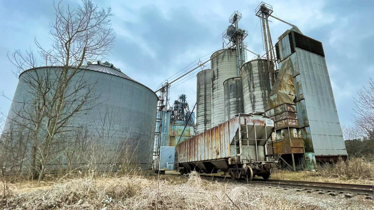 Rustic scene in Cavan Ontario along the CP Havelock sub where a 1980 built hopper sits waiting for pickup.
