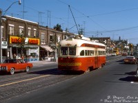 A 1970 Pontiac Grand Prix cruises by some small businesses that lined the street as TTC PCC 4528 passes southbound on the short-lived Mount Pleasant streetcar route during its final week of operation in July 1976. A TTC line truck for overhead work is visible waiting at the light at Manor Road, and beyond that signage for the Crest Theatre. A car nearby sports a yellow "City" plate on back (taxi?). The blue and white AMC Gremlin on the right may have been owned by Bryce (a similar one was seen in some of his other photos).<br><br>In the final year of streetcar service on Mount Pleasant Road, the Mount Pleasant portion of the St. Clair streetcar that ran between St. Clair subway station and Eglinton Loop (Eglinton/Mount Pleasant) was separated into its own route, the Mount Pleasant streetcar, that operated until it was discontinued at the end of July 1976.<br><br><i>J. Bryce Lee photo, Dan Dell'Unto collection slide.</i><br><br><u><i>More Mount Pleasant streetcar memories:</i></u><br><br>Mount Pleasant near Eglinton: <a href=http://www.railpictures.ca/?attachment_id=37064><b>http://www.railpictures.ca/?attachment_id=37064</b></a><br>AMC Mount Pleasant Motors: <a href=http://www.railpictures.ca/?attachment_id=31154><b>http://www.railpictures.ca/?attachment_id=31154</b></a><br>Dominion Coal silos by Merton: <a href=http://www.railpictures.ca/?attachment_id=30929><b>http://www.railpictures.ca/?attachment_id=30929</b></a>
