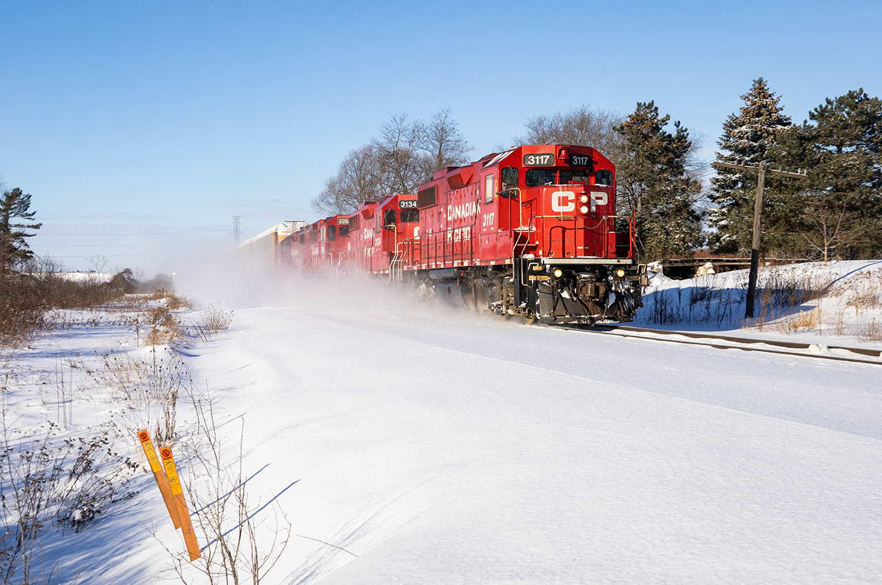 A quartet of red CP geeps takes a handful of racks from Wolverton to Hagey, a usual morning operation around these parts. These guys were going track speed, so it caught us off guard that we had only just barely beat him here.