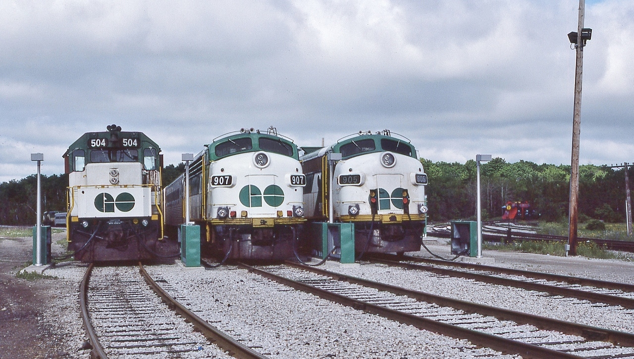 On a busy Sunday morning, just enough time to capture the GO line up awaiting Monday morning departures


    ( and too busy to capture the west end of these ! Note the CP Rail plows at right. )


   GO 504 ( ex GO 604) is an original GMD 1966 built GP40TC (built on a SD40 frame) and in 1995 to Amtrak 196, rebuilt & reclassified as a GP38H-3 and renumbered to 524.


   GO 907 is ex ONR FP7A #1504 converted to  APCU in 1976 and retired 1995


   GO 905 is ex ONR FP7A #1500 converted to  APCU in 1976 and retired 1995


    At CP Rail Guelph Junction, June 8, 1986 Kodachrome by S.Danko  


    More Guelph Jct: 


       busy morning