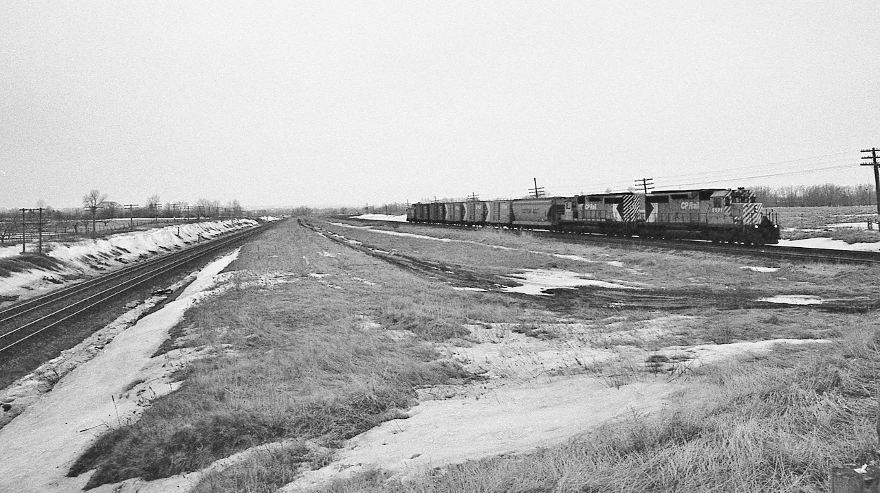 Compare to today...the starkness of the railway right of way landscape really astounds me 


   and at the time, this type of landscape along the R of W was the norm...


   A pair of SD40's easily handle the eastbound CP Rail Coburg Turn.


   At left, that is mile 284 CN Kingston Subdivision 


  At CP Rail Lovekin, March 5, 1978 Tri X negative by S.Danko


   Interesting: the Multimarks, the Cotton Belt hopper, the CPR script lettered caboose....