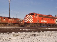<br>
<br>
    VIA Canadian F power: ex CP Rail FP9A 1407 and F9B 4474 at Agincourt for servicing by CP Rail on behalf of the  VIA Rail, 
<br>
<br>
    Also: MLW RS10s CP Rail 8598, a bunch of SW1200RS's, MLW M636 4721 is coupled to the B end of 4474.
<br>
<br>
    First generation power abounds at Agincourt, December 9, 1978 Kodachrome by S.Danko.
<br>
<br>
    Noteworthy: within weeks 4474 renumbered to 1961 retired 1983, 1407 retired by 1983.
<br>
<br>
    And that CPR script water tower....
